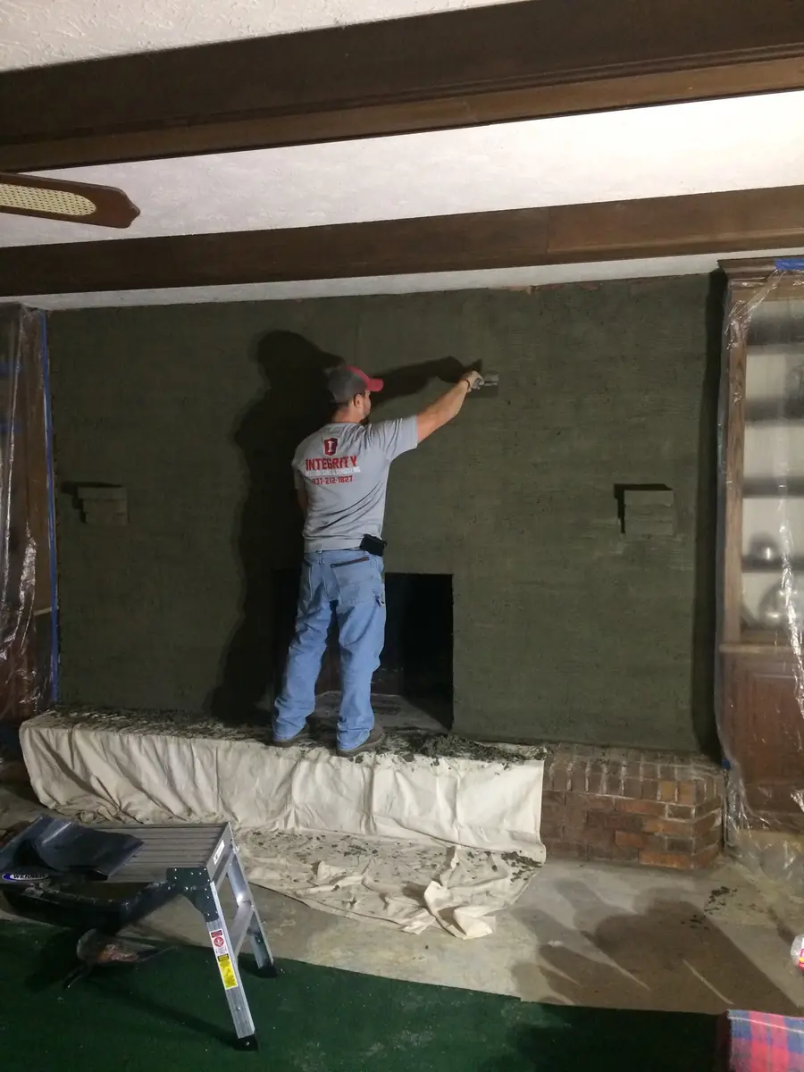 The fireplace wall being framed before the stonework